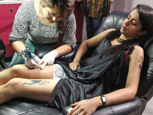 Trisha Getting Inked On Thighs