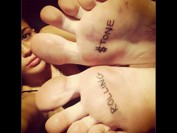 Gets Rolling Stone Tattoo On Feet